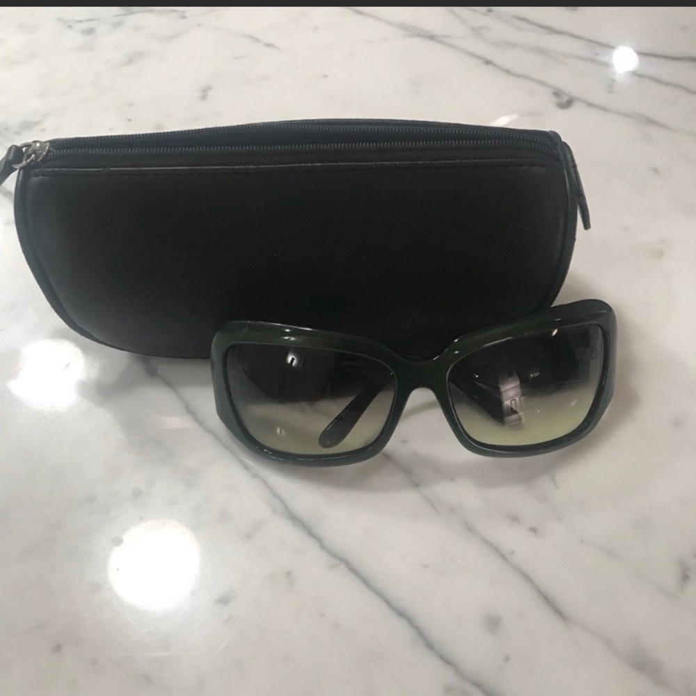 Oliver People’s green sunglasses